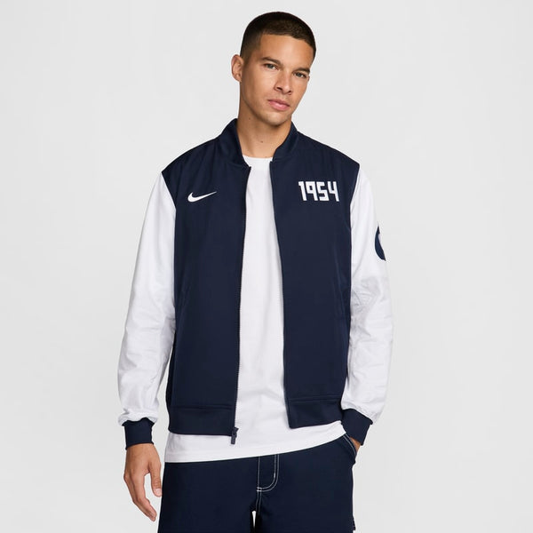 Chamarra bomber de fútbol Nike de tejido Woven y sin forro para hombre Pumas UNAM Sport Essentials - Azul