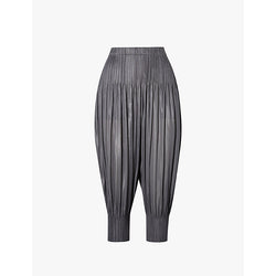  Pleats Please Issey Miyake Pleated tapered-leg mid-rise knitted trousers