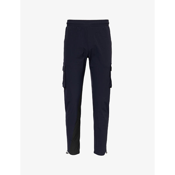 Arne Tapered-leg mid-rise stretch-woven trousers