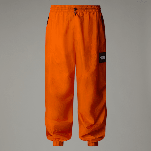 The North Face Unisex Tnf X Yinka Ilori Wind Shell Trousers Red Orange