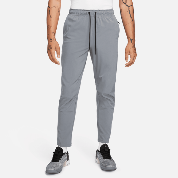Pants Versátiles Dri-Fit De Pierna Entallada Para Hombre Nike Unlimited Gris